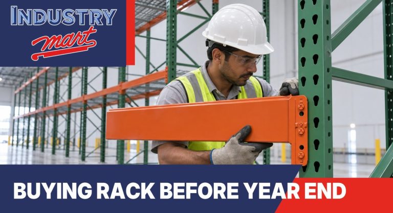 Installer hanging an orange beam on a green pallet rack upright frame in a warehouse